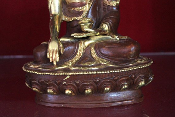shakyamuni buddha statue lotus base and rice bowl gold